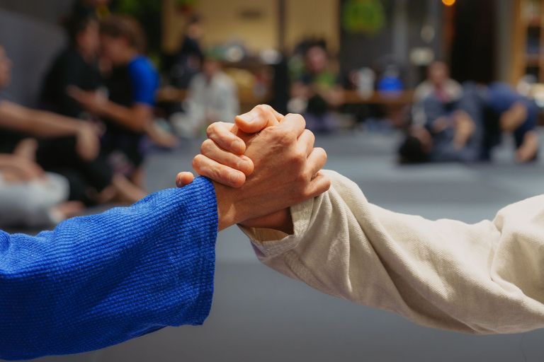 Two athletes grappling in a Brazilian Jiu Jitsu match