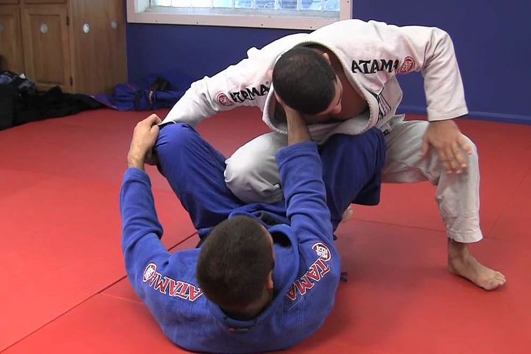 Instructor opening and passing the closed guard in the gi