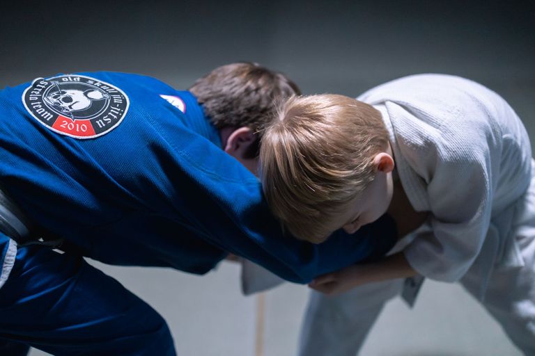 Two athletes competing in a Brazilian Jiu Jitsu match