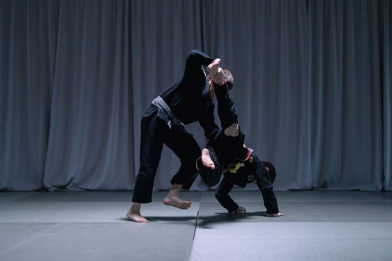 Brazilian Jiu Jitsu competitors grappling in the gi