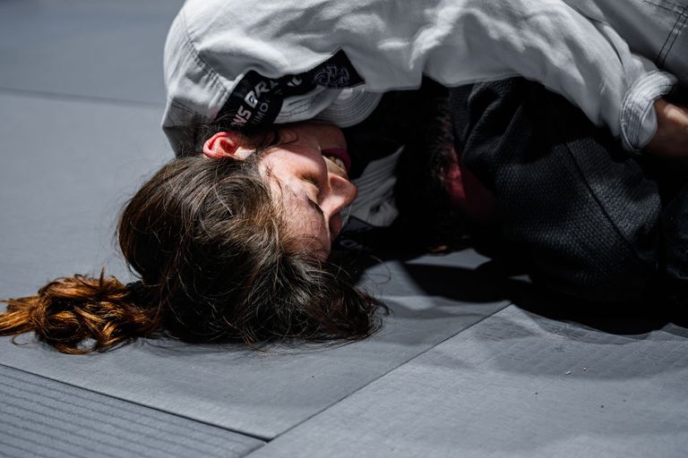 Two athletes competing in a Brazilian Jiu Jitsu match