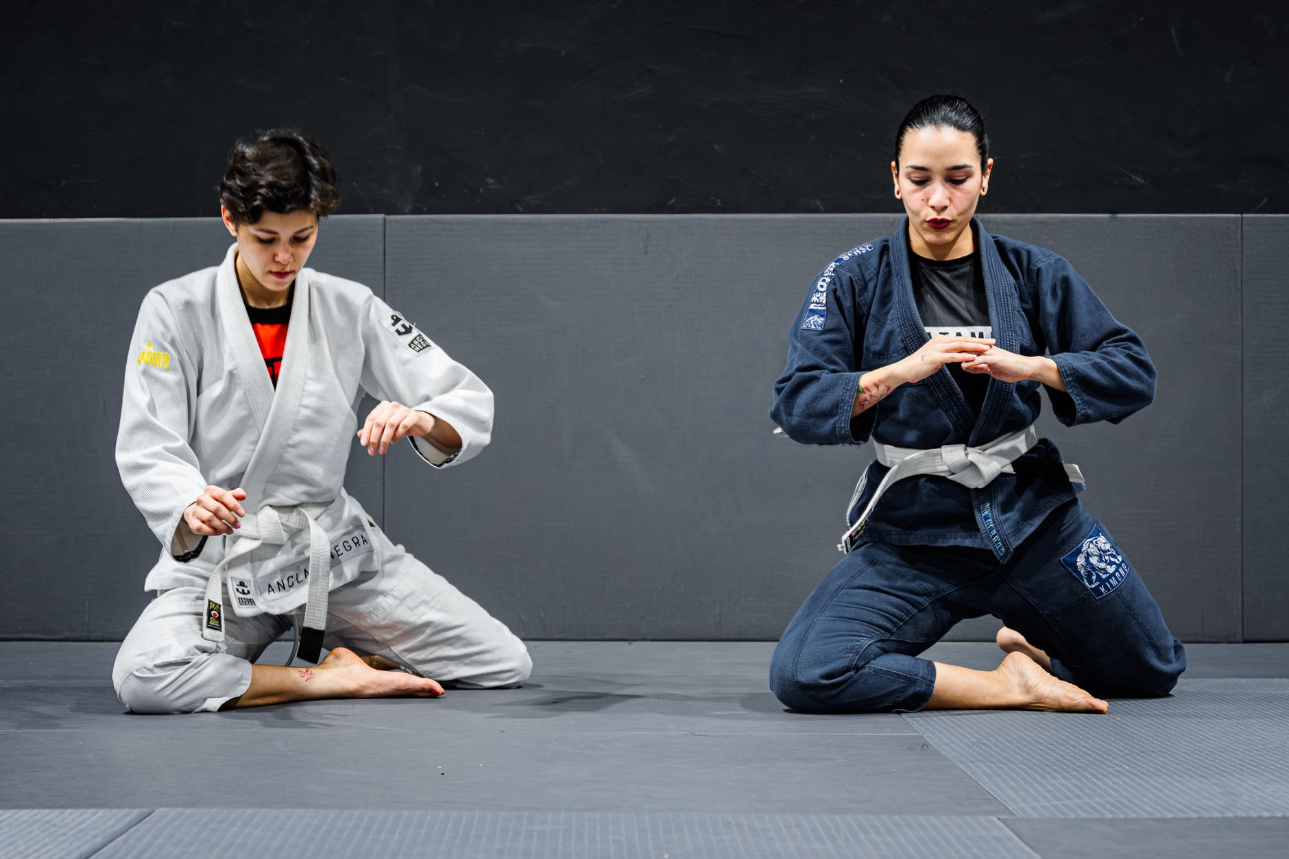 Two athletes competing in a Brazilian Jiu Jitsu match