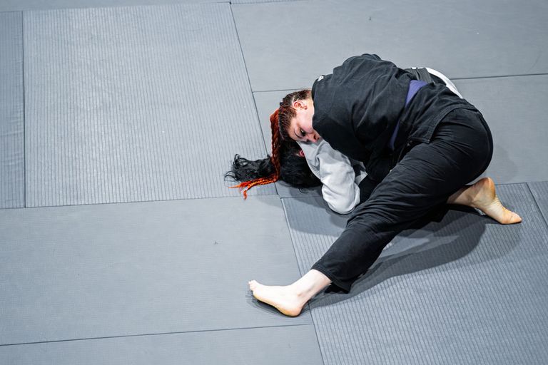 Two athletes competing in a Brazilian Jiu Jitsu match