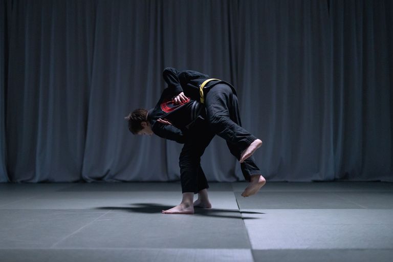 Athletes training Brazilian Jiu Jitsu on the mat