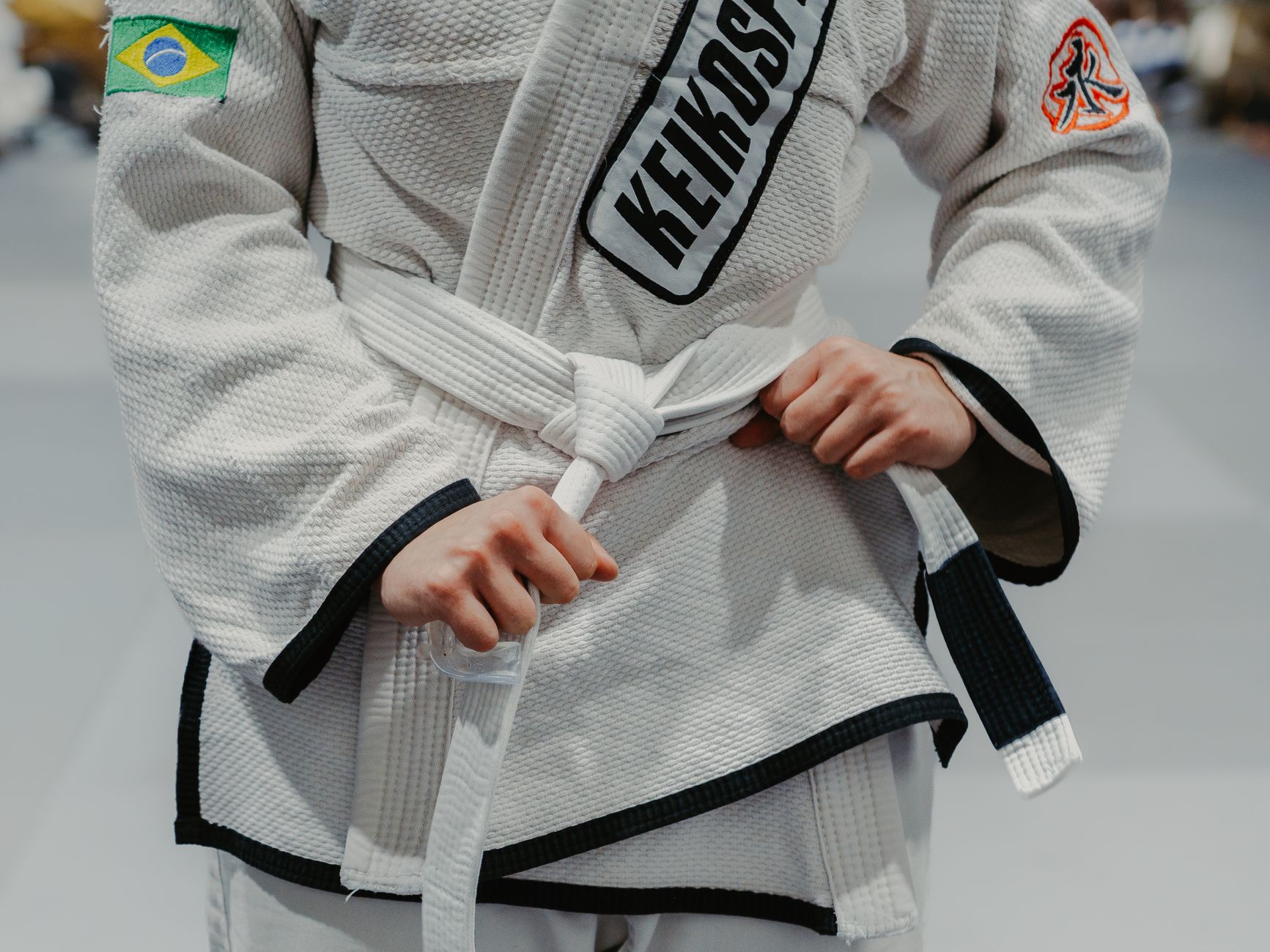 Brazilian Jiu Jitsu competitors grappling in the gi