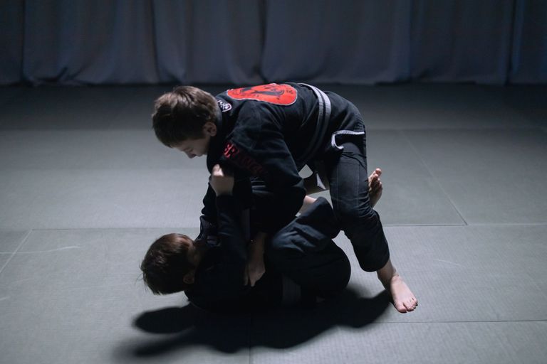 Two athletes competing in a Brazilian Jiu Jitsu match