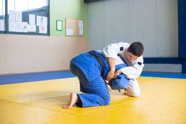 Two athletes competing in a Brazilian Jiu Jitsu match