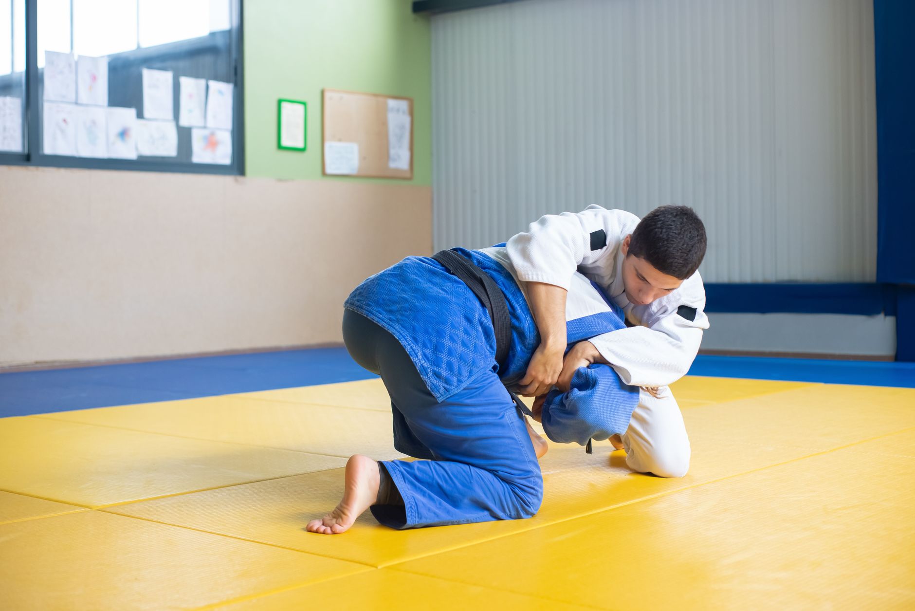 Two athletes competing in a Brazilian Jiu Jitsu match